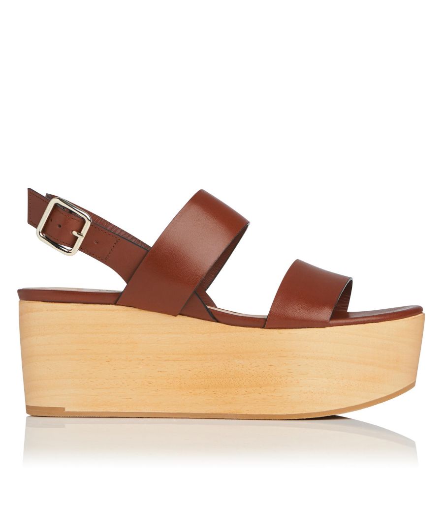 Inspired by a bygone era, our Colleen platform sandals exude a retro charm that's perfectly suited to the warmer months. Dressed with chunky, 1970s wooden platform sole and crafted in the softest tan leather, these statement-making platforms will add edge to ethereal maxi dresses and breezy linen separates this season.