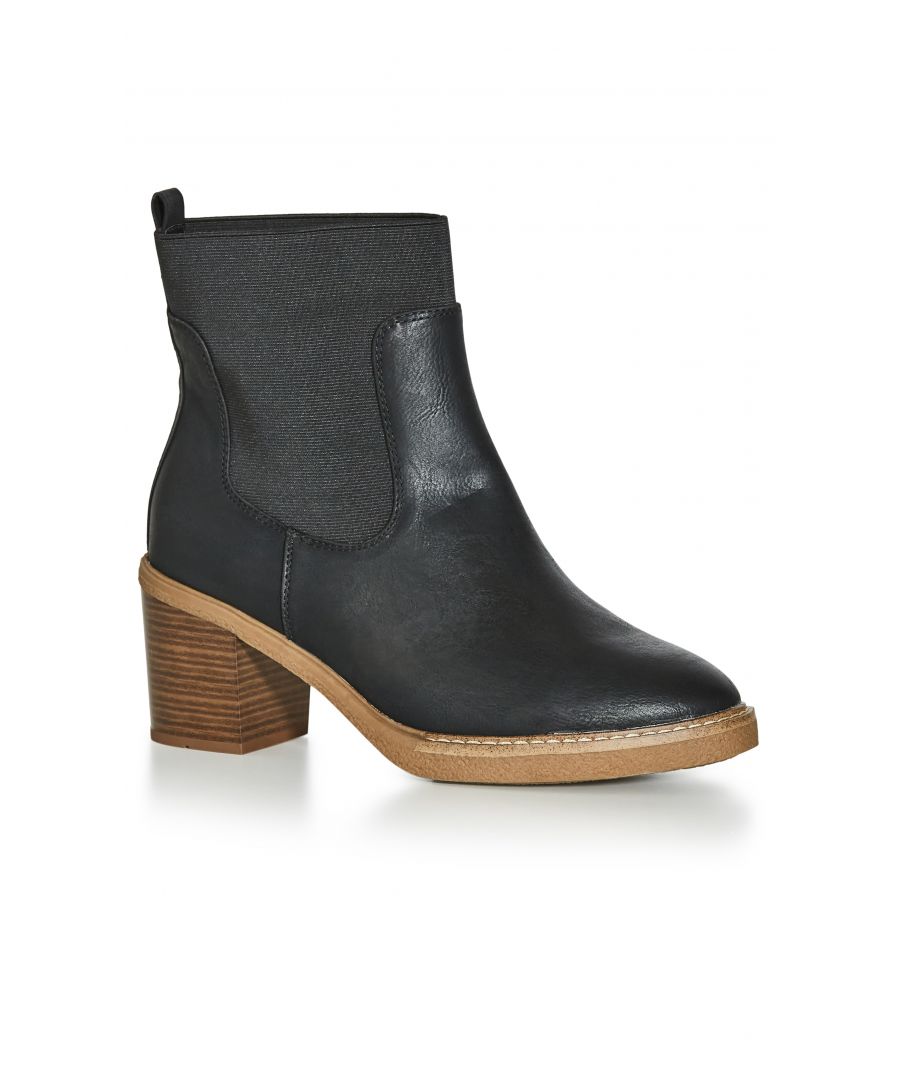 Refresh your footwear collection with the Brooke Ankle Boot. Complete with a wooden block heel and faux suede fabrication, move from day to night in the extra wide fit. Key Features Include: - Round toe - Extra wide fit - Slip on style - Elastic contrast - Wood stacked block heel - Faux leather fabrication