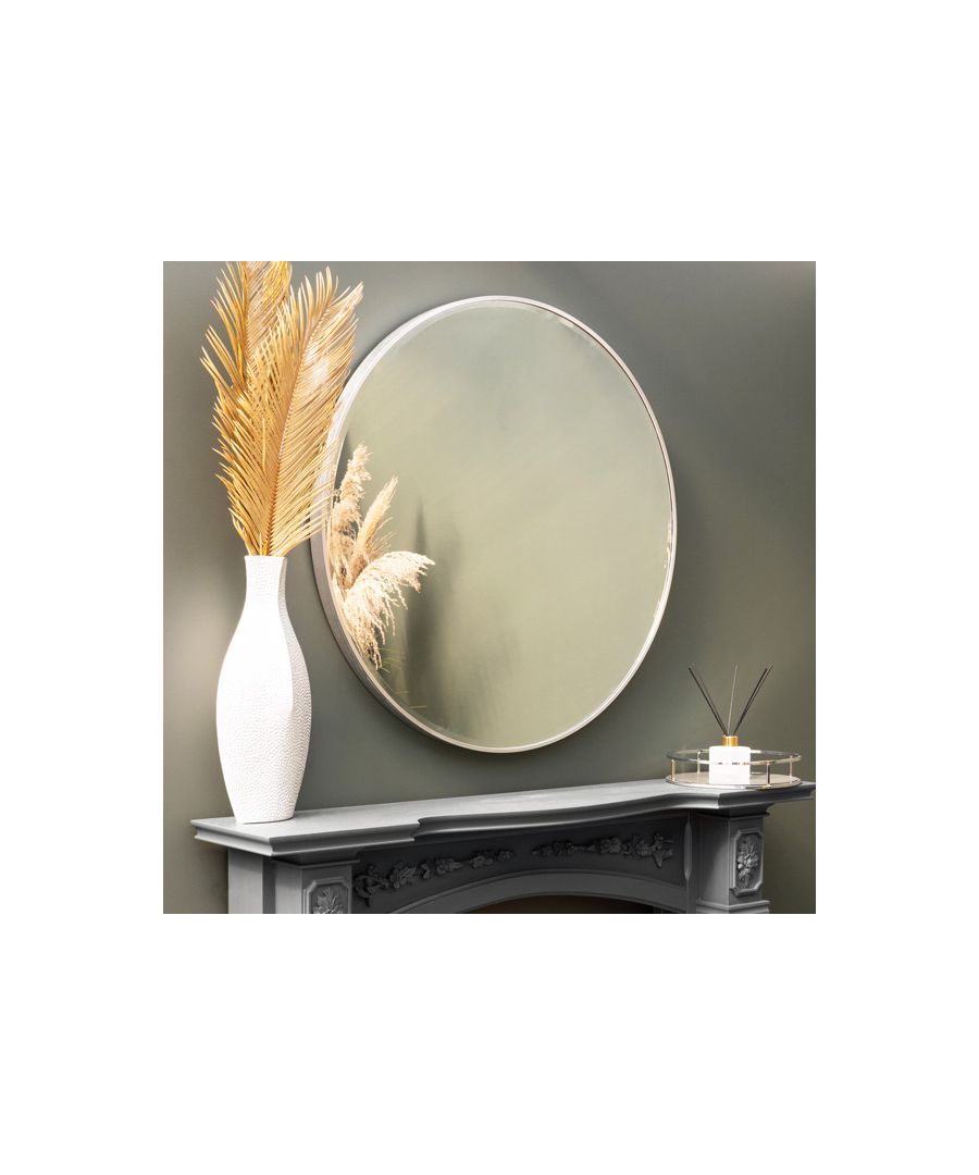 Upgrade a bare wall with a circular mirror, adorning an accent of refinement to your walls with this metallic mirror, featuring a silver frame. Round mirrors are the interior design trend that just won’t cease.\n \nAfter appearing in Pinterest’s 2017 trend report, these round wall accents have been popping up everywhere to challenge the square status quo. It’s easy to understand their appeal over other straight-lined versions, the soft curved shape turns this functional fixture into a modern decorative accent and helps balance the angular lines of other furniture pieces.\n \nClean and uncomplicated, this silver framed mirror can adorn both contemporary and classic interiors, delivering a soft touch of modernity or providing the impression of increased space and light in slighter rooms.\n \nFeatures: \n\n\nTrending circular shape\n\n\nSilver frame\n\n\nWall mirror\n\n\n \nProduct specification: \n\n\nProduct Type: Mirrors\n\n\nWeight: 9.00kgs\n\n\nDimensions: H80cm x W80cm x D4.2cm