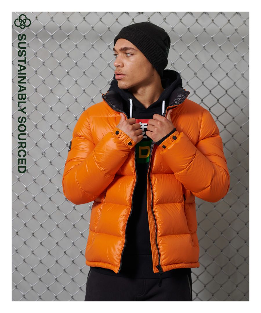 Wrap up warm this season with the Luxe Alpine Down Padded Jacket featuring a responsibly sourced down padding and fleece lined pockets for added comfort.Main zip fasteningTwo zipped fastened pocketsPopper elasticated cuffsBungee cord hemSignature logo badgeSuperdry is certified by the Responsible Down Standard to confirm that our down filled products are sourced to ensure animal welfare.