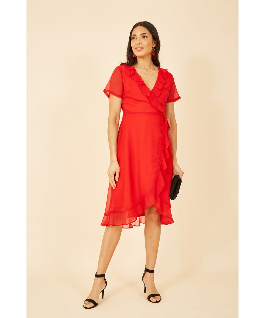 Twirl into the party spirit with the Yumi Red Frill Wrap Dress. It’s cut in a classic wrap shape with gentle ruffles running from shoulder to hemline. The waist is pulled in by a tie that’s enhanced by a stylish tassel, with a lining underneath to finish. Complete your look with block heels.