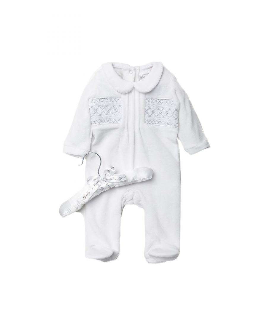 This adorable Rockabye Baby Boutique white, velour sleepsuit features a lovely smocking detail. The sleepsuit is footed, with popper fastenings, with collar detail. The set is cotton, keeping your little one comfortable. This set comes with a satin hanger, making a lovely baby shower gift for the little one in your life!
