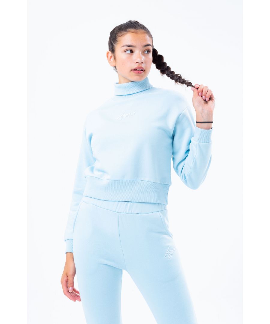 The cutest sweatshirt you'll need this season, and every season after that. The Hype. pale  blue high neck kids crop sweatshirt features an embroidered mini HYPE. script logo in a tonal blue. The fabric boasts a blue soft-touch base for supreme comfort. With a crew neckline and long-sleeves with fitted cuffs and a roll neck perfect to keep you warm the wintery months. Machine wash at 30 degrees.