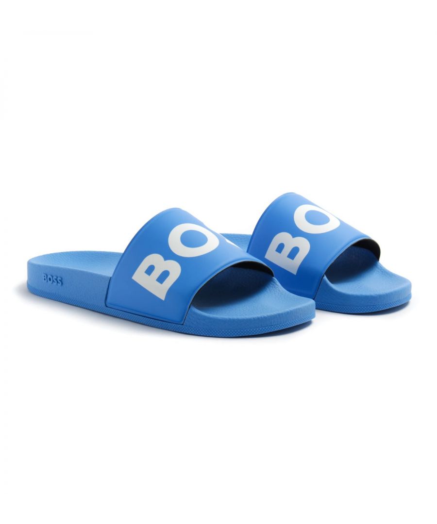 Slide your feet into premium style with the Sean Slides from BOSS. These lightweight quick drying slides are ready to make a statement with the brand new BOSS logo printed across the rubberised foot straps. Perfect for the pool, beach, garden or even lounging around. Featuring an ergonomically designed footbed for optimum comfort and a non slip outsole. Synthetic Rubber Composition, Ergonomic Designed Footbed, Non Slip Outsole, Made in Italy, BOSS Branding.