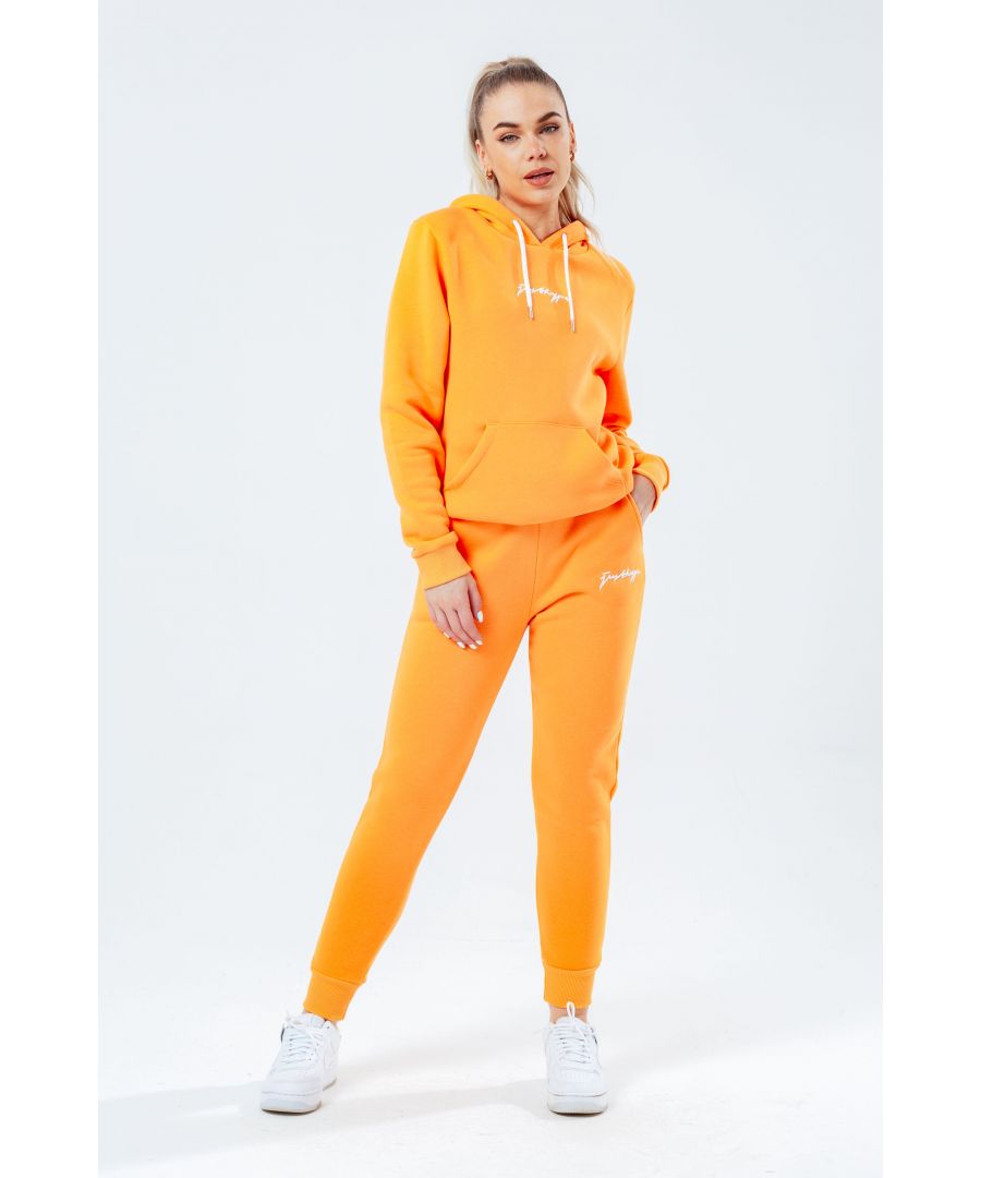 The Hype Light Orange With White Signature Script Women'S Hoodie & Jogger Set is your new go-to loungewear set when you need that extra comfort boost. Designed in 80% Cotton 20% Polyester for the ultimate soft touch feeling! The Hoodie features a fixed hood, kangaroo pocket, fitted hem and cuffs, finished with contrasting white pullers and embossed justhype embroidery across the front. The Joggers highlight an elasticated waistband, fitted cuffs and double pockets with contrasting white pullers and embossed justhype embroidery on the side of the leg. Wear together or stand alone with a pair of box fresh kicks. Machine washable. 