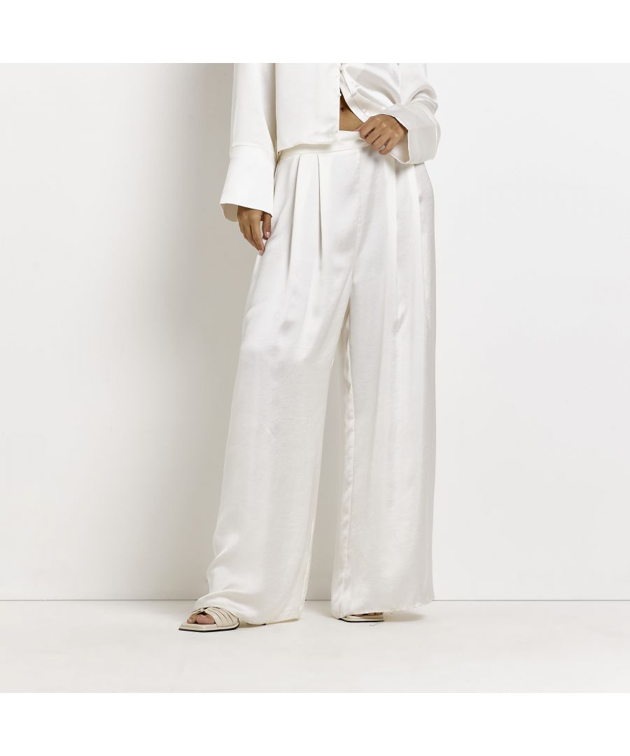 > Brand: River Island> Department: Women> Colour: Stone> Type: Trousers> Style: Wide Leg> Material Composition: 100% Polyester> Material: Polyester> Pattern: No Pattern> Occasion: Casual> Size Type: Regular> Season: SS22