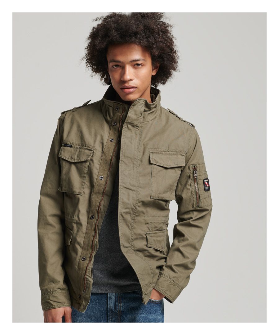 Military style has long been an inspiration and, with the Classic Rookie jacket, it is no different. All those classic styling cues feature in this lightweight cotton jacket so that you can bring an element of military ruggedness to your everyday look.Relaxed fit – the classic Superdry fit. Not too slim, not too loose, just right. Go for your normal size.Zip and popper fasteningSeven-pocket designPopper cuffsDrawstring waist with leather adjustersFully linedSingle inner pocket