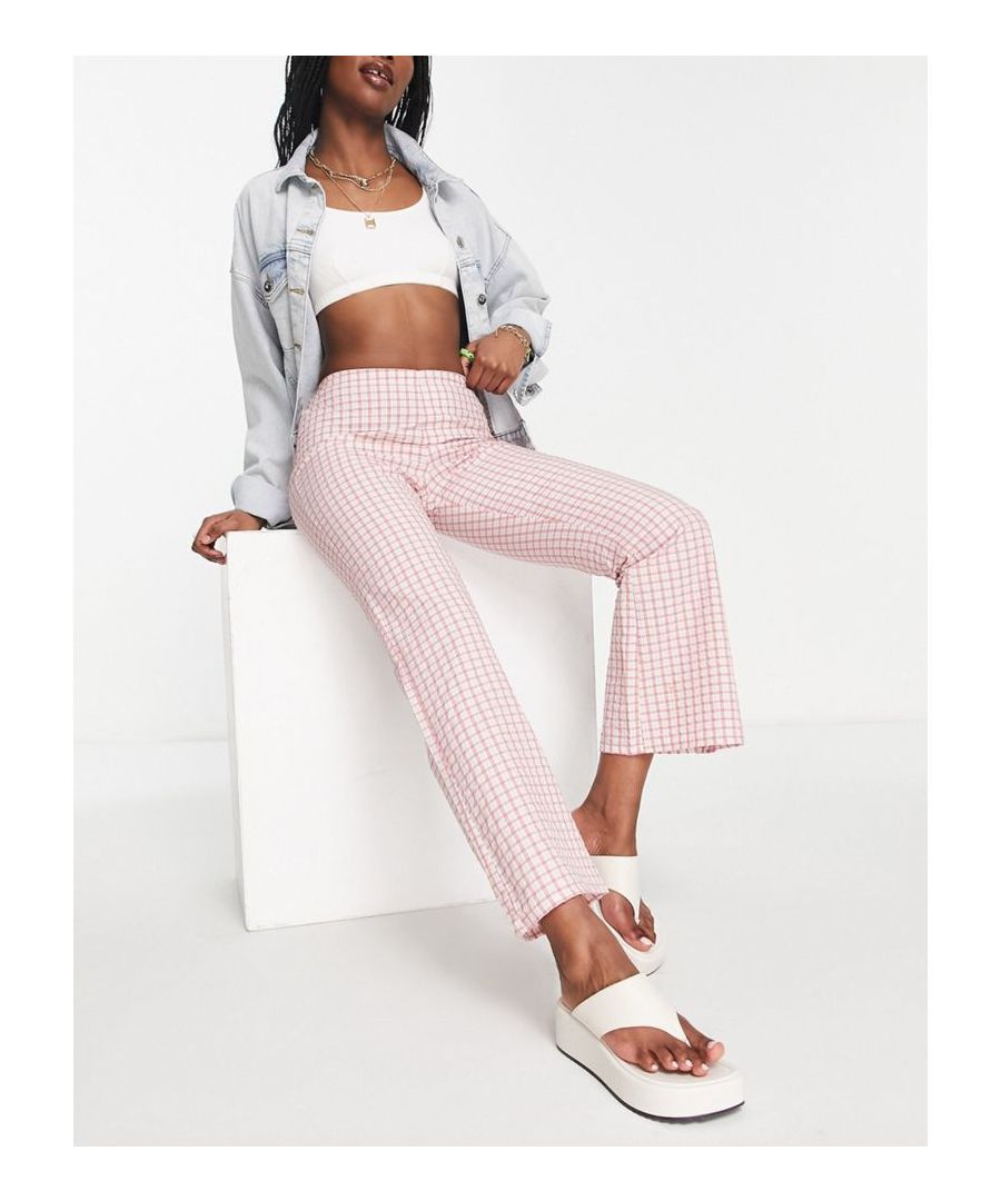 Petite trousers by ASOS DESIGN Treat your lower half Check design High rise Stretch-back waist Flared straight fit Sold by Asos