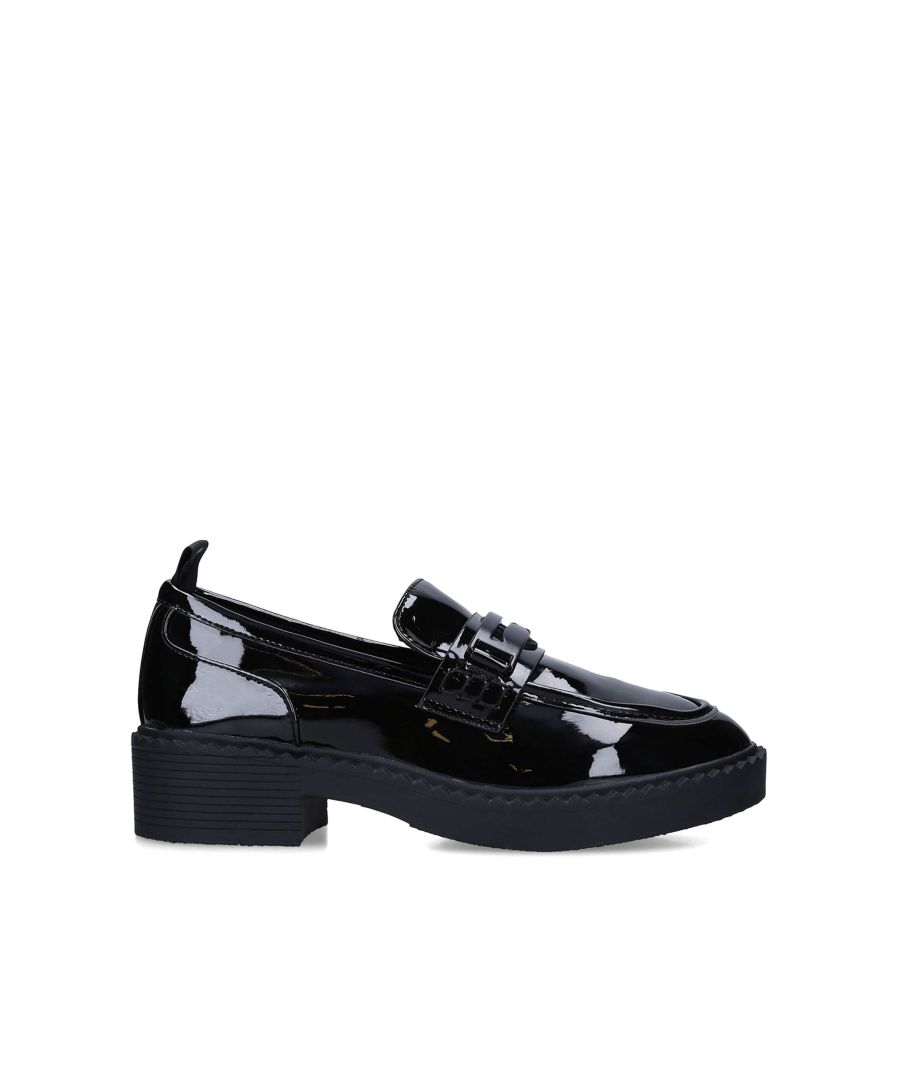 The  Madison Gem shoe arrives in black with a patent shiny upper and black metal strap across the toe. Under the strap is a black rubber monacle.