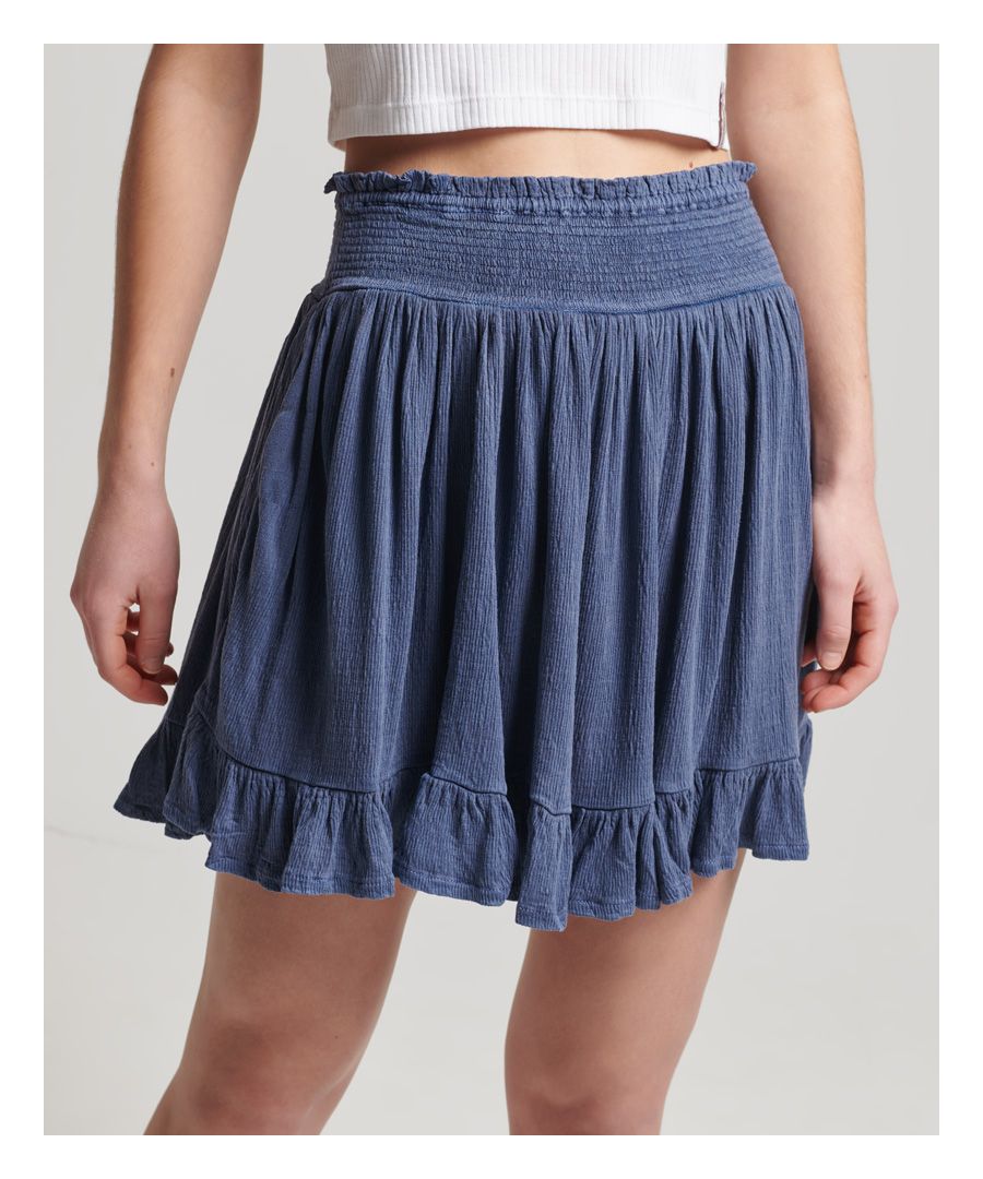 Deze jersey Summer-rok is perfect voor warm weer en heeft een elastische tailleband en verborgen zijzakken. Ziet er geweldig uit met een blouse en sandalen voor een zomerse look.Elastische taillebandVerborgen zijzakkenElastische zoomKenmerkend metalen logolabel