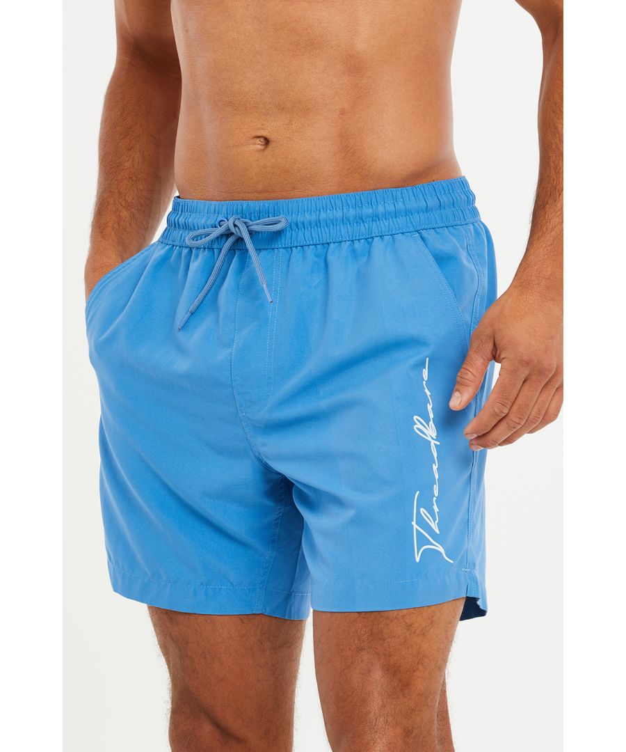These swim shorts from Threadbare are made of quick-drying, recycled polyester with a mesh liner. They feature an elasticated waistband with adjustable drawstring and 2 side pockets. Perfect for the beach or by the pool. Other colours and prints available.