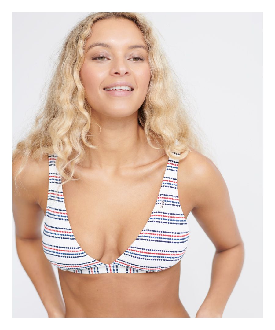 Superdry women's Edit stripe bikini top. Featuring double adjustable shoulder straps, a hook fastening at the back, removable padding in the cups for added comfort, and an elasticated hem. Finished with a small metal Superdry logo badge on the neckline.