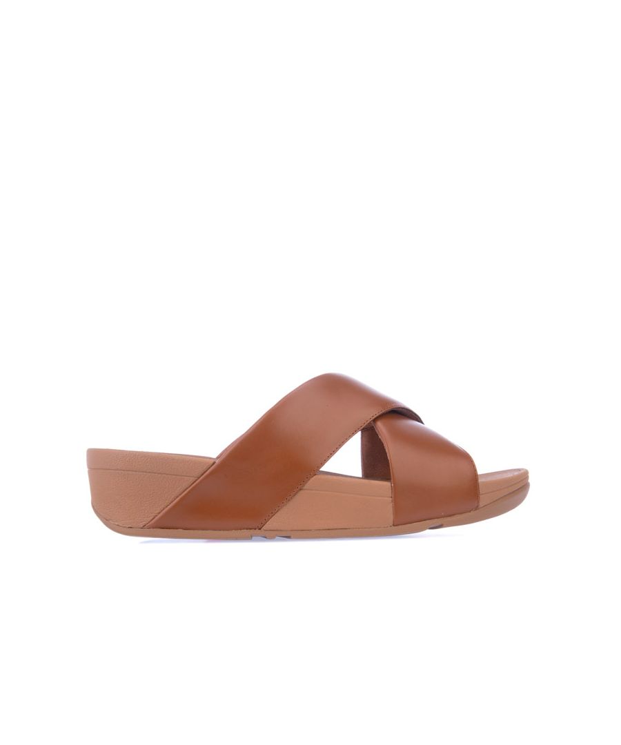Womens Fit Flop Lulu Cross Slide Sandals in tan.- Soft leather uppers.- Slip on closure.- Biomechanically engineered  comfortable.- Microwobbleboard midsoles. - APMA* seal of acceptance.- Seamless built-in arch contour.- Slip-resistant rubber outsole.- Leather upper  Textile lining  Synthetic sole. - Ref: K04592