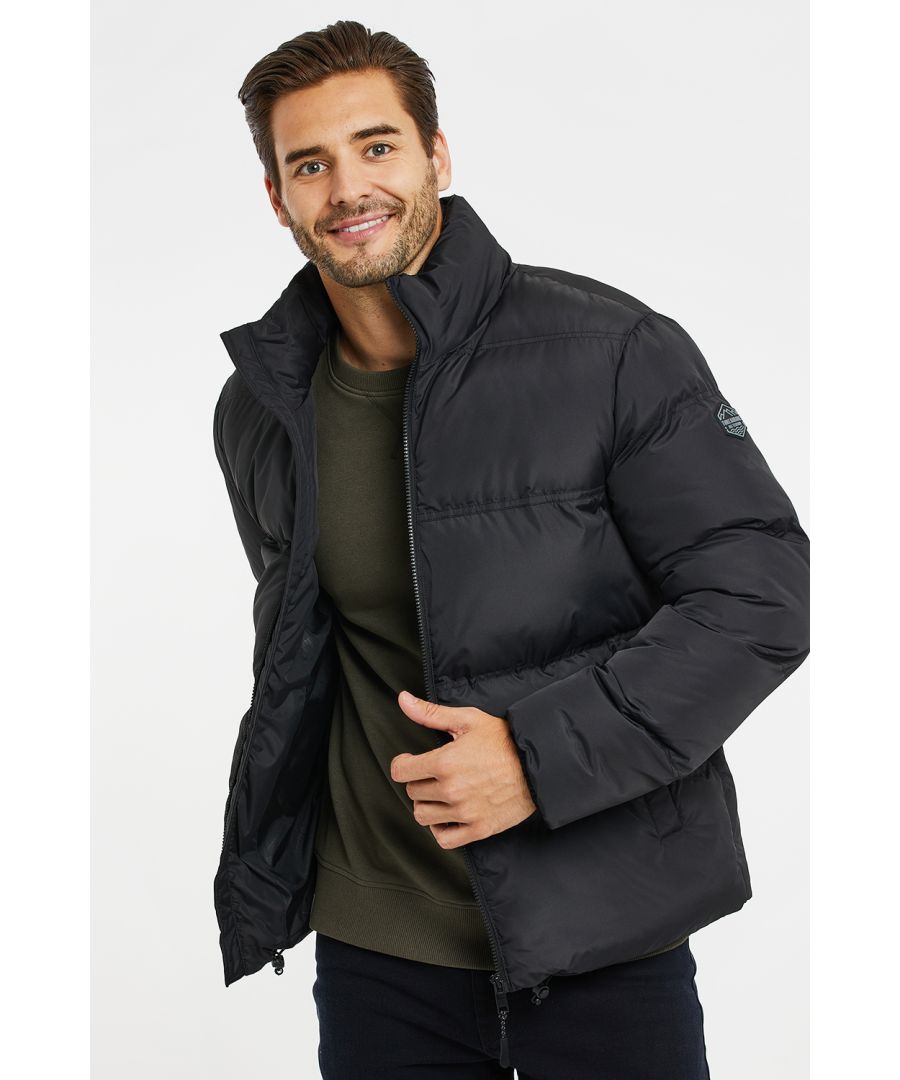 This stylish puffer jacket from Threadbare has a padded funnel neck and the hem can be adjusted with bungee cords. It features two front pockets and is finished with brand logo on the left arm. Wear with jeans and a jumper this season.