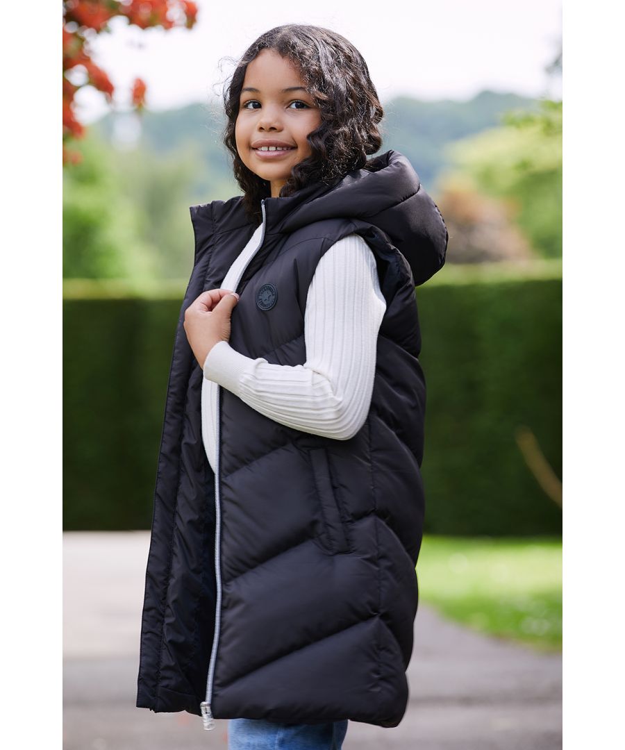 Add an extra layer with this longline padded gilet from Threadgirls featuring a hood, zip fastening, two side pockets, and a rubber branded badge on the chest. Style with knitwear and jeans for a smarter look or for something more casual wear with a sweat co-ord. Other styles are also available.