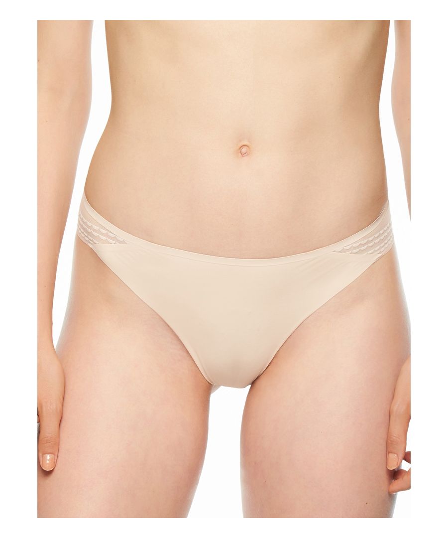 Passionata by Chantelle Freedom range is the perfect lingerie collection. These mid rise briefs have a cheeky back cut for minimal coverage. These tanga knickers are smooth underneath clothing, but the flat lace back makes them more feminine. Lined gusset for all day comfort. Size Guide: XS (8), S (10), M (12), L (14).