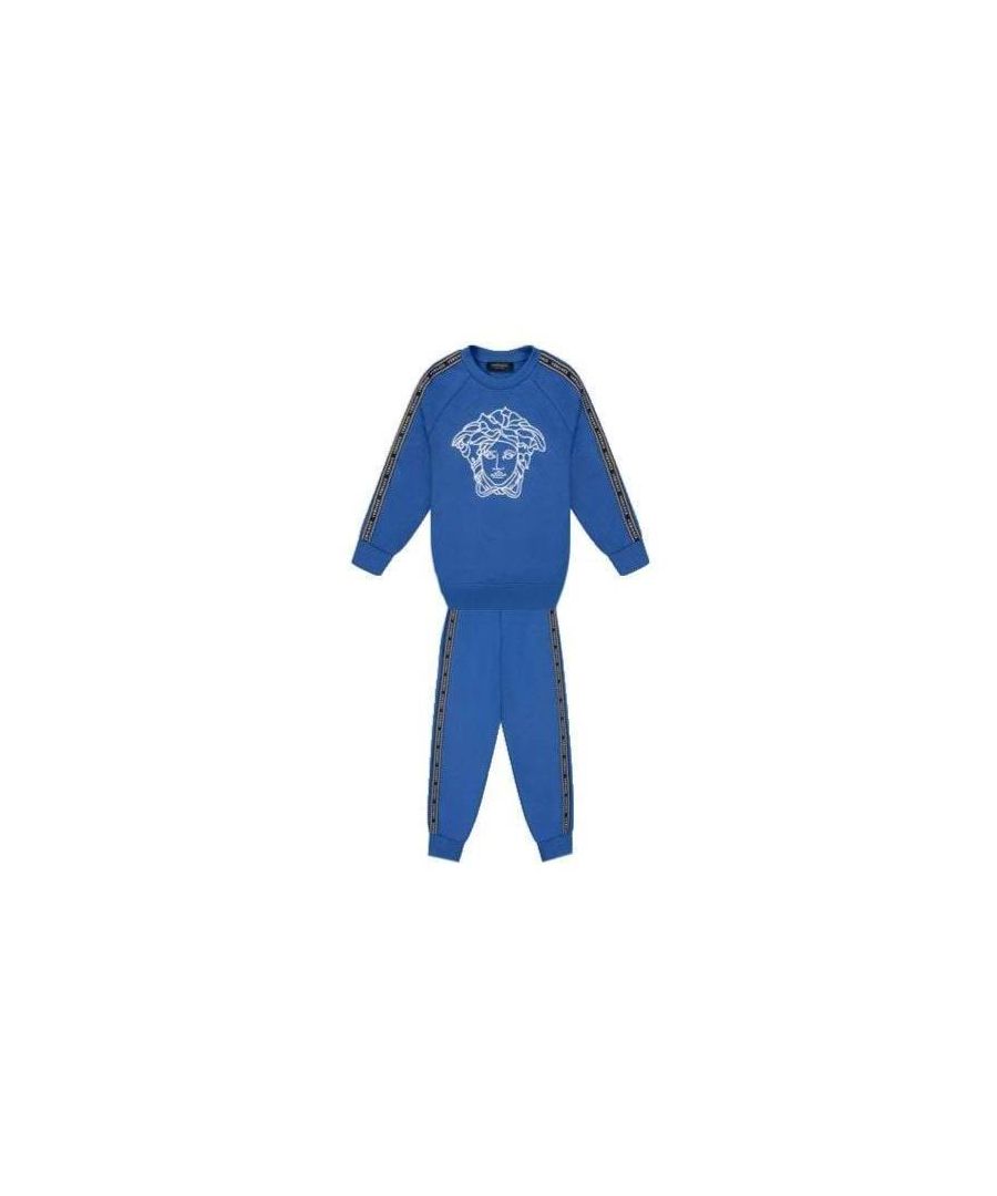 This blue Tape Logo Tracksuit from Versace kids is crafted from cotton and features a medusa head motif, stripe trim, a round neck on the top and a stripe trim and elasticated waistband and ankles on the bottoms.
