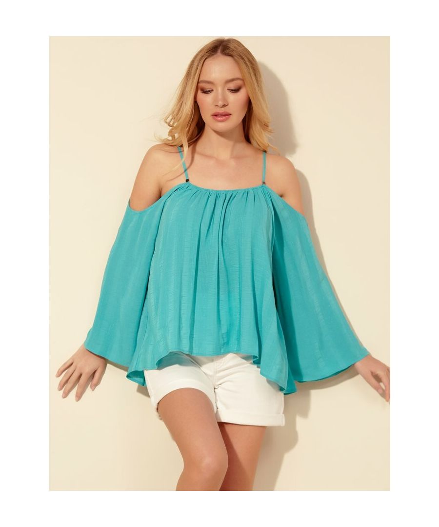 Our cold shoulder blouse is a must have this summer. Featuring thin straps, a cold shoulder design, flowing sleeves and a relaxed fit, this blouse is the perfect piece to create relaxed glamour look.