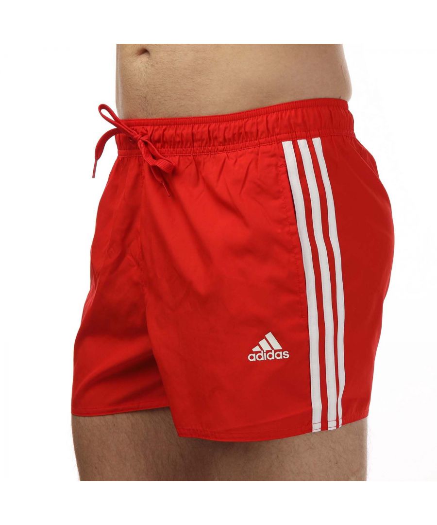 Mens adidas Classic 3- Stripes Swim Shorts in red.- Drawcord on elastic waist.- Front pockets.- Soft  quick-drying fabric.- Inner mesh brief.- 100% Polyester (Recycled). - Ref: HA0391