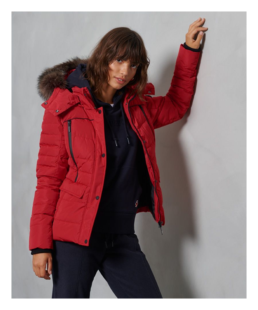 Layer up for extra warmth and comfort in the Glacier Padded Jacket. This jacket features a recycled polyester padding for insulation, who knew being sustainably friendly could look so good? Perfect for completing any outfit this season.Main zip and popper fasteningDetachable, bungee cord hoodRemovable faux fur trimSix pocket designRibbed cuffsRecycled paddingSignature logo badgeThe padding in this jacket is 100% Recycled Polyester – each jacket contains up to 10 recycled bottles, this avoids these bottles being sent to landfill or polluting our oceans.