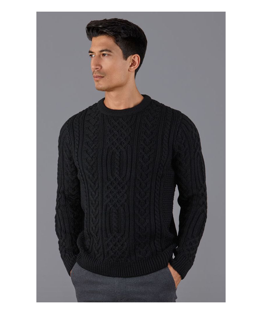 Fisherman Aran Sweater - Made in Great Britain\nIf you are looking for a thick and warm winter wool jumper the Anderson is for you. Made from the softest 100% merino wool, the Anderson is the perfect addition for your weekend wardrobe. Set the look off with dark faded jeans and some hard wearing boots.\nModel Wears\nCharcoal Grey - Chan is 6ft (182cm), chest size 40