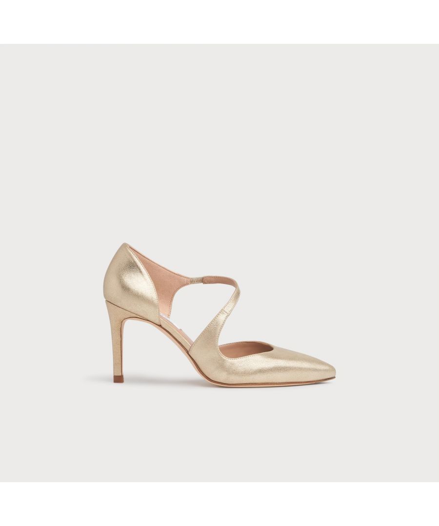 Our Victoria courts, with their stylish d'orsay cut, look beautiful on the foot. Crafted in Spain from shimmer gold suede, this sleek style has a pointed toe, asymmetric cut-out detail and a slender 85mm stiletto heel. Wear Victoria as an alternative to a full court during the occasion season.
