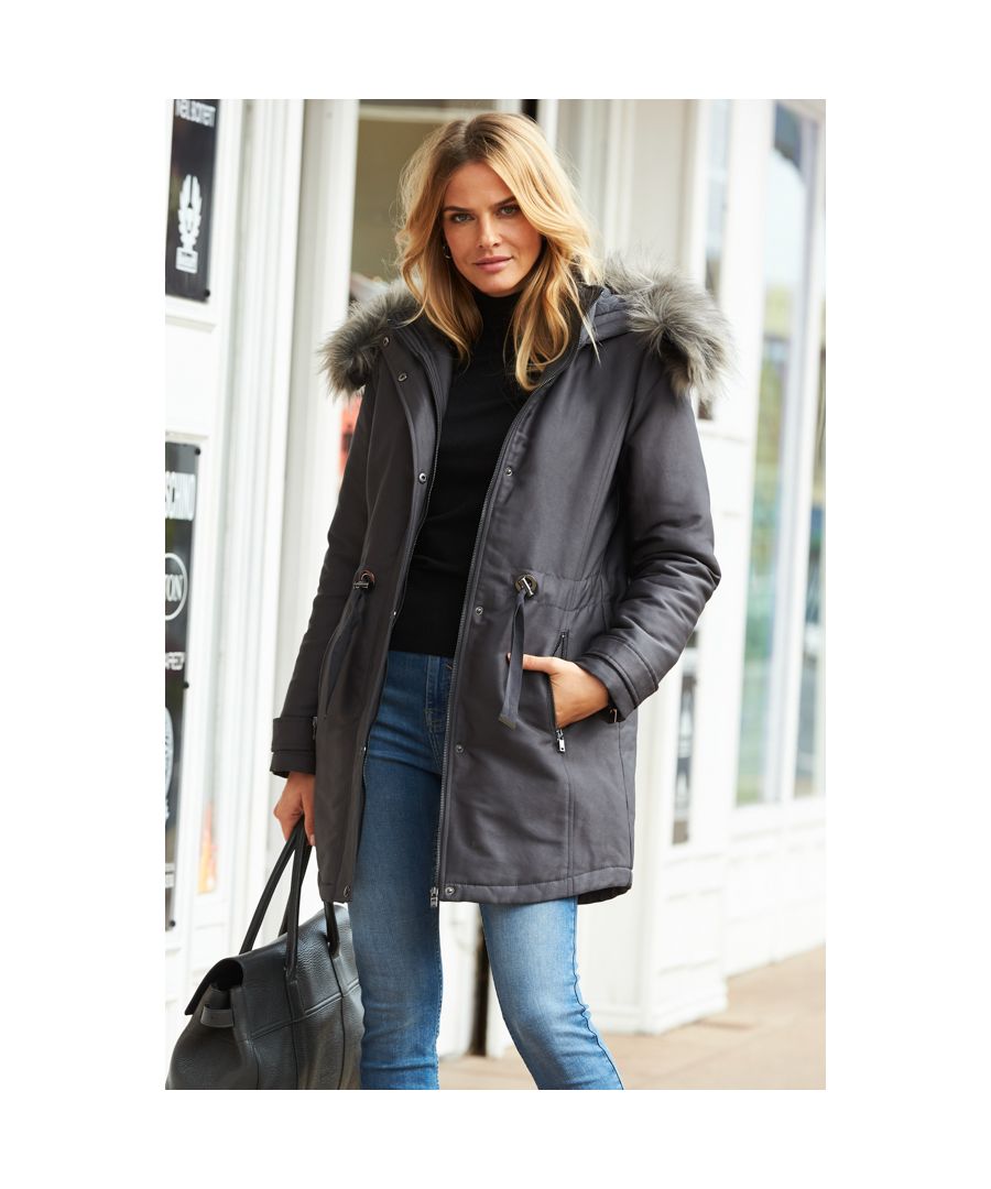 REASONS TO BUY: You'll wear it year after year. Classic parka design. Luxe faux fur hood for extra cosiness. Flattering drawstring waist. Go-with-everything grey shade. Wear it with jeans and boots or throw over a dress.