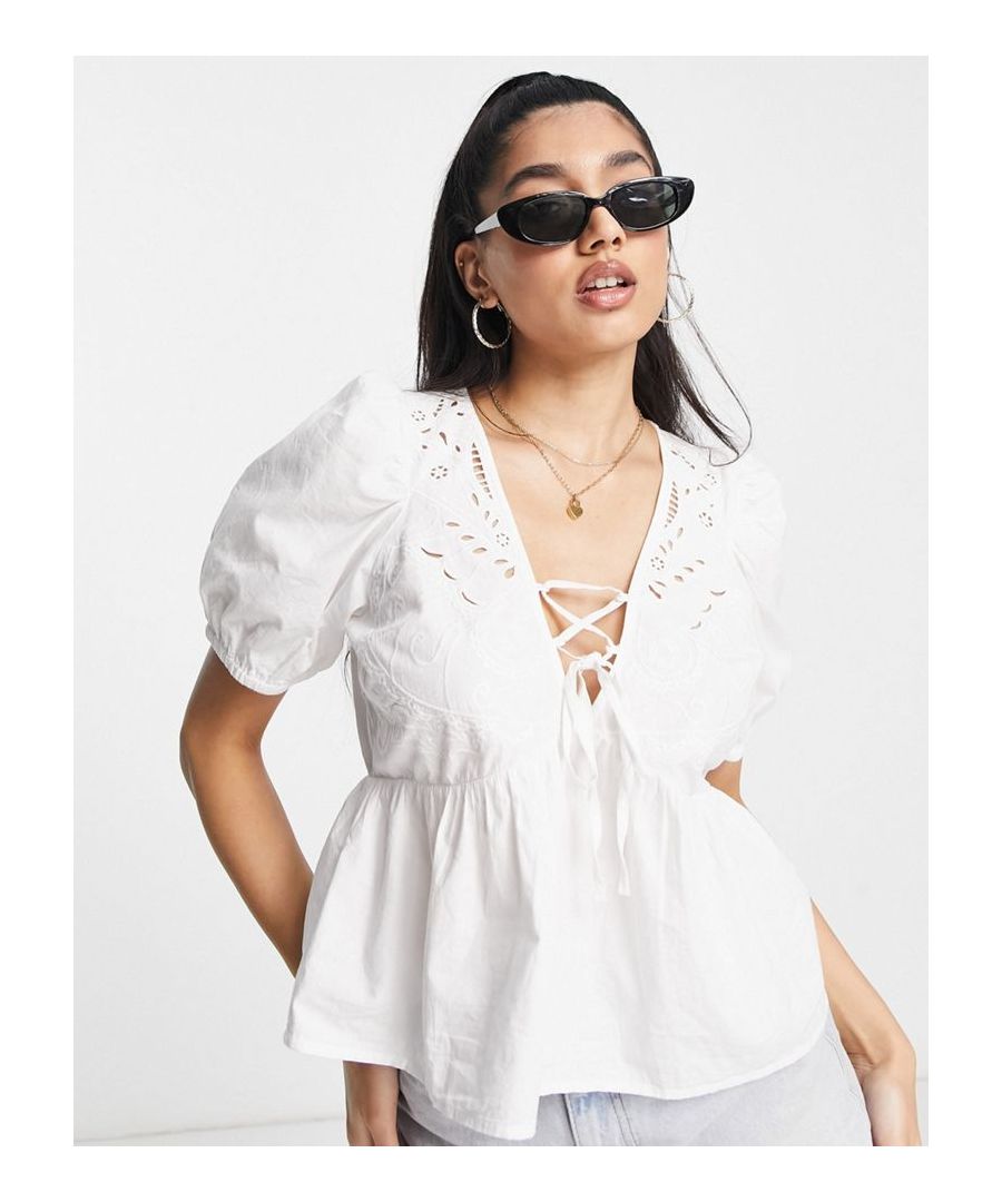 Top by ASOS DESIGN Cos your jeans deserve a nice top V-neck Puff sleeves Tie front Cutwork details Regular fit Sold by Asos