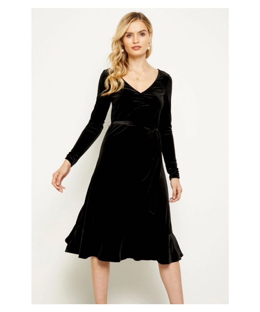 REASONS TO BUY: \n\nIt’s not like your other LBD’s \nRuched V-neck, nipped in waist, flared skirt – it’s made to flatter \nLuxe velvet fabric \nOn-trend ruffle hem \nYour feel-good party go-to \nBlack courts are classic but metallic heels make a statement 