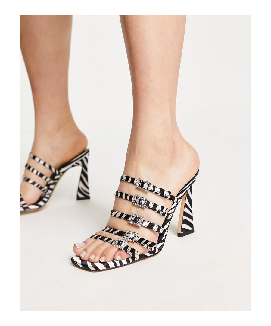 Mules by Topshop Dress from the feet up All-over zebra print Slip-on style Adjustable pin-buckle straps Diamante details Open toe High flared heel  Sold By: Asos