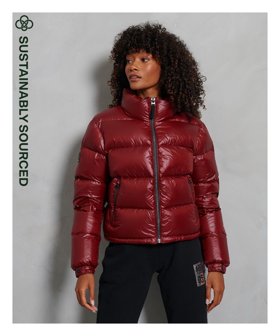 Stay warm in style this season. This padded jacket has been filled with a 90/10 down filling for extra comfort and warmth. Available in a variety of colours so that you can pick which one best suits your style.Main zip fastening90/10 down fillingTwo pocket designBungee cord hemElasticated popper cuffsSignature logo badgeSuperdry is certified by the Responsible Down Standard to confirm that our down filled products are sourced to ensure animal welfare.