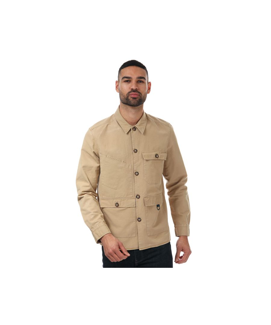Mens Ted Baker Bikee Multi Pocket Shacket in beige.- Pointed collar.- Full button closure.- 3 button pouch pockets on the front and a slip pocket.- Contrast buttons.- Classic subtle Ted Baker tag branding on the side.- 75% Cotton  25% Linen.  Machine washable.- Ref: 253321BEIGE