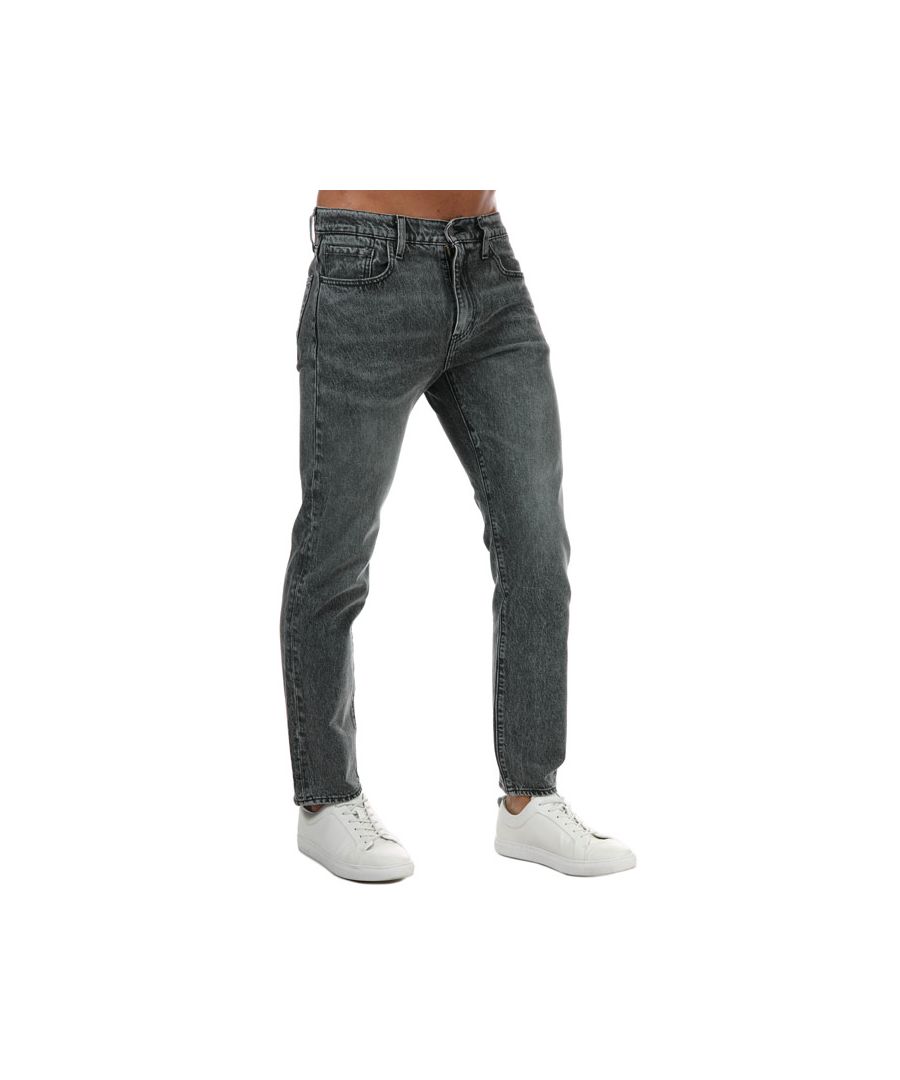 Men's Levi’s 502 Taper Jeans in easy stonewash black. Levi’s 502 Taper jeans are a classic taper fit for every day with extra room for comfort  a refined alternative to straight jeans.  Engineered with Warp Stretch technology for increased mobility and built-in recovery so jeans keep their shape.- Classic 5 pocket styling.- Zip fly and button fastening.- Sits below waist.- Regular fit through seat and thigh with a leg that narrows at the ankle.- Slightly tapered leg.- Short inside leg length approx. 30in  Regular inside leg length approx. 32in  Long inside leg length approx. 34in.  - 99% Cotton  1% Elastane.  Machine washable.- Ref: 29507-0751. Measurements are intended for guidance only.