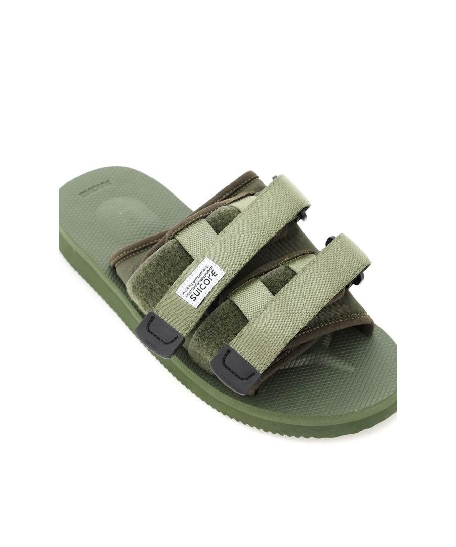 MOTO-Cab mules by Suicoke crafted in padded nylon with suede edges, fabric lining and double adjustable fabric strap with velcro, one of which with a fabric logo patch. Rubber sole with moulded insole. 