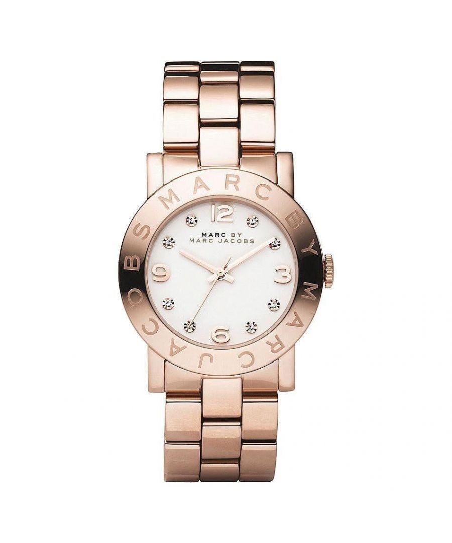 PRODUCT INFO - Case Diameter: 36mm   Case Material: Rose Gold Tone Stainless Steel   Water Resistant: 50 Metres   Movement: Quartz (Battery)   Dial Colour: White   Strap Material: Rose Gold Tone Stainless Steel   Clasp Type: Push-Button Deployment   Gender: Female\n\nDESCRIPTION - This elegant piece blurs the lines between jewellery and timepiece, making it perfect for the fashion- forward female. It is made from a Rose Gold stainless steel bracelet and has a sleek bracelet design in Rose Gold Tone metal and fastens with a push-button deployment. FREE Home Delivery - Including Next Day Service*. Available for gift wrap. We offer free bracelet adjustment service on this product. Please contact customer services\tReturns policy