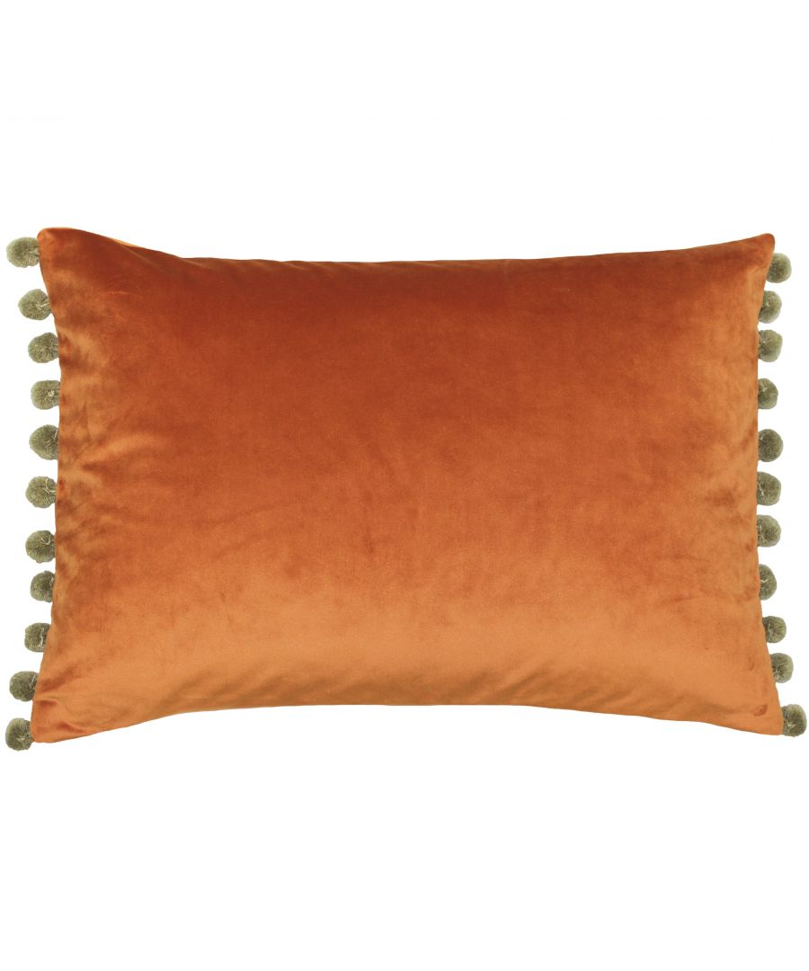 The name gives away this cushion’s greatest asset. The Fiesta cushion, aptly named after the Spanish word for festival, is a plethora of bright colours and mixed tones. The velvet body of the cushion is an absolute delight to touch thanks to its sublimely soft texture and catches the light from every angle. Contrasting coloured pompoms feature along the edges to further enhance the fun and tactile nature of this cushion. With a hidden zip closure nothing takes away from this cushions unique design. While this Polyester Filled Cushion is not machine washable due to its gorgeous pompoms it is iron appropriate.