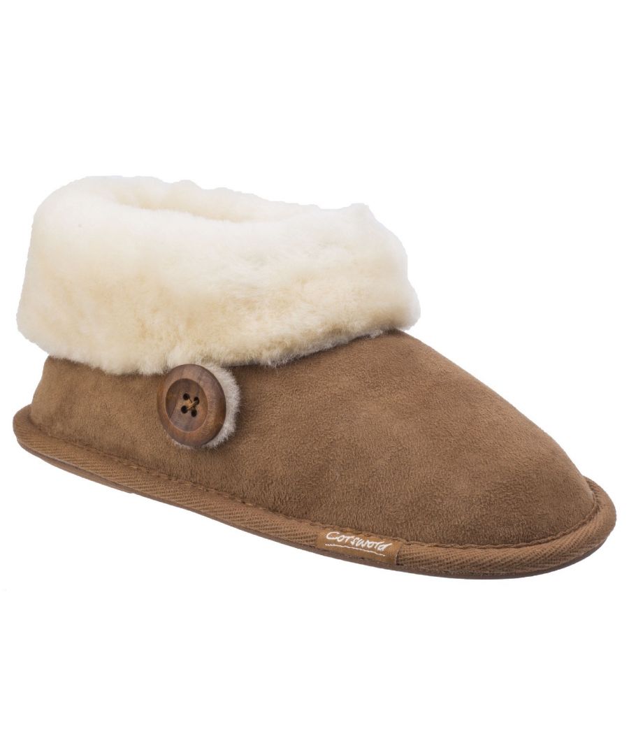 Inspired by cosy country cottages and village home comforts of the Cotswold Hills, Wotton is a premium bootie slipper with luxurious double faced sheepskin, soft suede uppers and gentle rubber grips for ultimate comfort.Crafted with a soft leather suede upper. \nLuxurious soft thick sheepskin lining and footbed. \nLarge double faced sheepskin wool cuff. \nBold natural toned button detail. \nComfort textile sole with rubber grip panels.