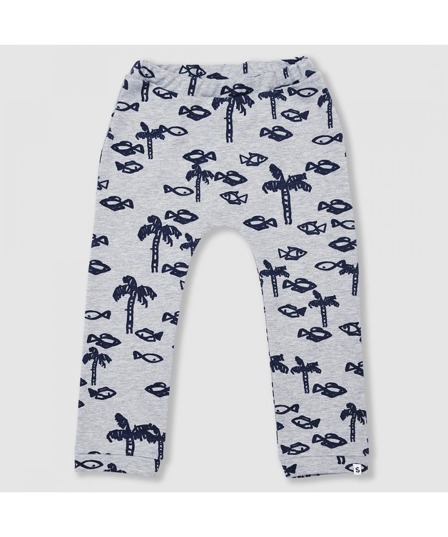 Relaxed fit joggers with elasticated waist and ribbed bottoms in grey melange featuring our all over painted navy fish and palm tree print. Made from a soft cotton mix with comfy brushed fleece interior. Designed to be unisex.