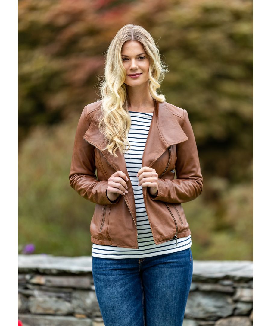 Inject instant style into your wardrobe with our Jill leather biker jacket in tan. The Jill is a style that returns year after year in new colourways. It's a best-selling style for a reason. The casual cut and slightly longer length accommodates all shapes and sizes. The larger collar is incredibly flattering with subtle design features that create the perfect casual biker jacket look.  Expertly crafted from soft and supple aniline leather, Jill is practical as well as stylish. The ever on-trend biker jacket features definitive details such as an asymmetric zip and two zip pockets with brushed metallic detailing.