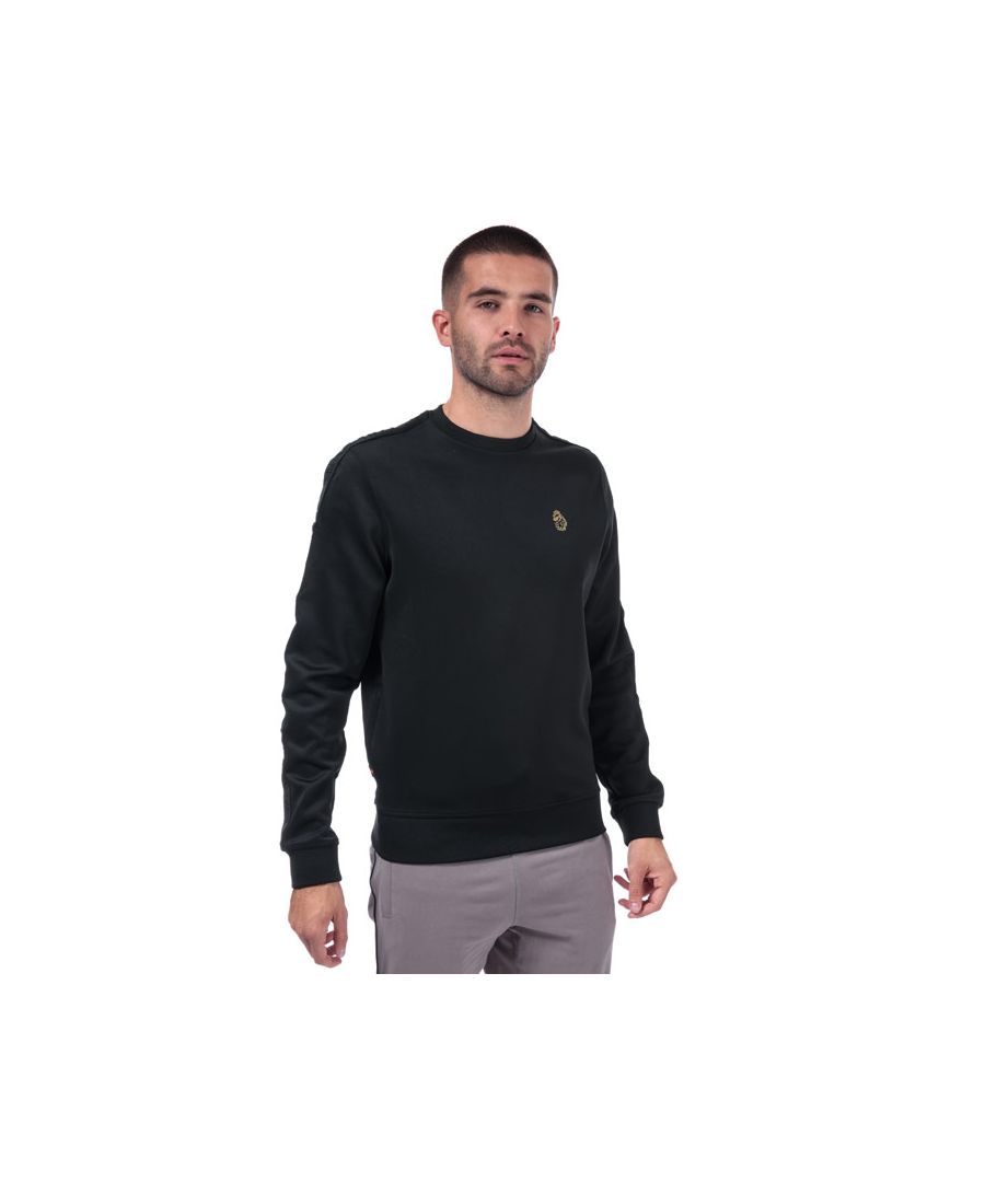 Mens Luke 1977 Tricco Sweat in Black.<BR><BR>- Crew neck.<BR>- Ribbed collar.<BR>- Long sleeves.<BR>- Branded sleeve tape.<BR>- Ribbed cuffs and hem.<BR>- Luke 1997 Lion badge to chest.<BR>- Woven tab to seam.<BR>- Shoulder to hem 27in approximately.<BR>- 90% Polyester  10% Elastane. Machine Washable.<BR>- Ref: M470340S<BR><BR>Measurements are intended for guidance only.