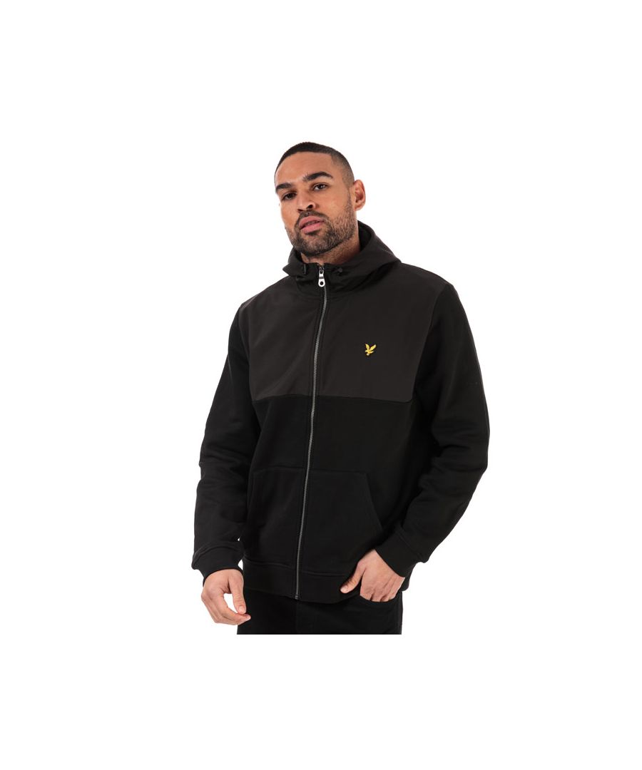 Mens Lyle And Scott Softshell Jersey Zip Hoody in jet black.- Lined hood with bungee-adjustable drawcord.- Funnel neck.- Full zip fastening.- Long sleeves.- Embroidered eagle logo at left chest.- Kangaroo style pockets to front.- Ribbed cuffs and hem.- Woven herringbone back neck tape.- Cotton jersey lower body and sleeves; softshell hood and upper body.- Main body: 100% Cotton.  Chest - hood - back: 100% Polyester.  Hood lining: 100% Cotton.  Machine washable.- Ref: ML1314VZ865