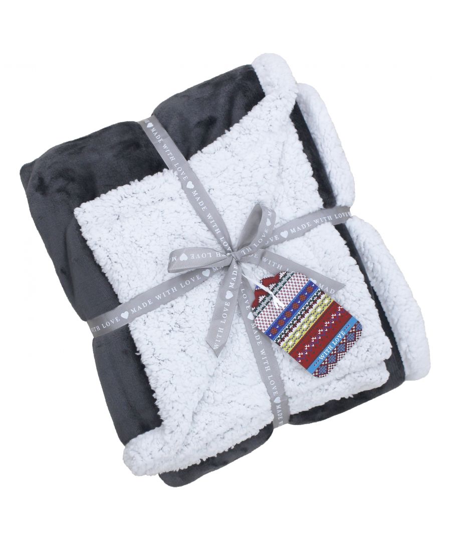 Prepare yourself for the holiday season with the Paoletti Luxe Sherpa fleece throw. Created with luxurious 220gsm microfleece for a super soft velvet feel front that emanates an opulent sheen. With a 250gsm Sherpa sheepskin reverse in optic white you'll be keeping toasty warm all night long. Serving as the perfect gift this throw is beautifully presented with a ribbon trim and comes complete with a festive Christmas tag. In a range of rich colours you'll find a choice to suit any home whether you're giving it as a gift or to dress up your own interior. Made of 100% hard-wearing polyester this faux fur throw can withstand the busiest of households whether you have children or pets. This gorgeous throw is incredibly easy to care for as it is fully machine washable at 30 degrees. Do not iron and lay flat to dry for the best results.