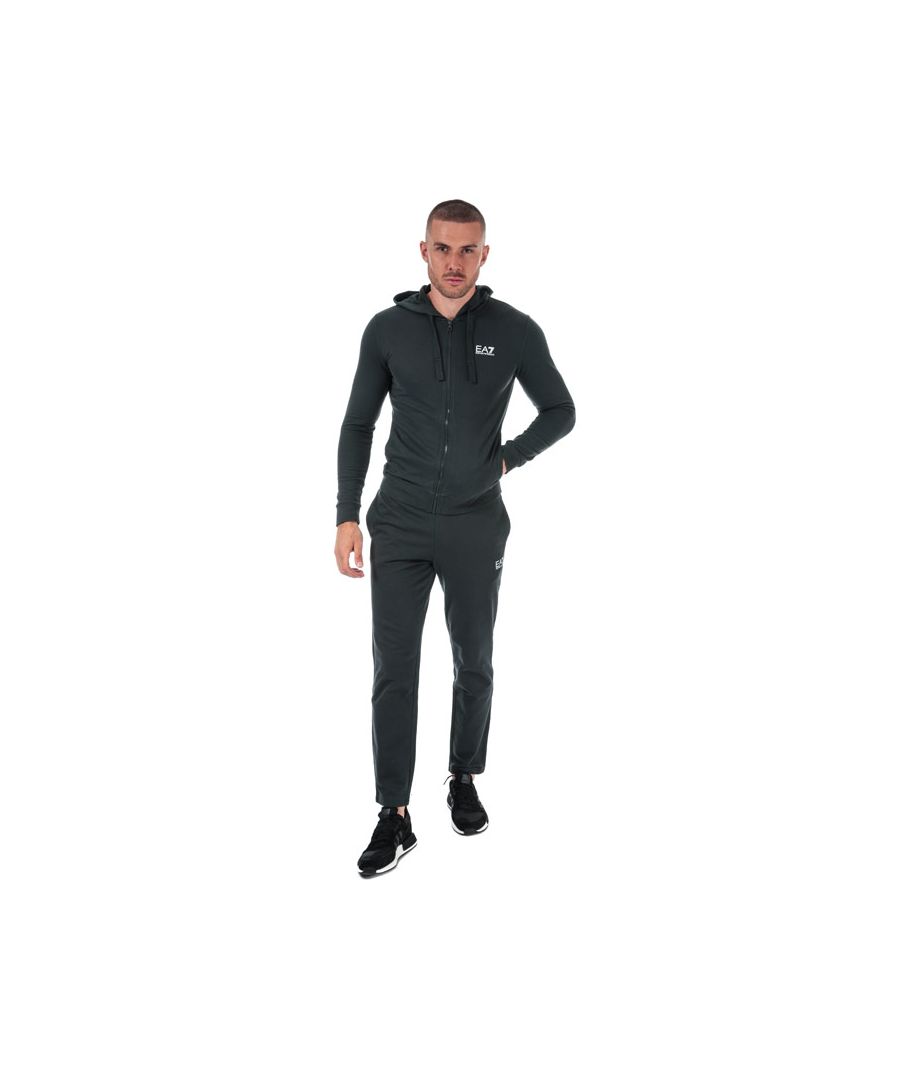 Mens Emporio Armani EA7 Core ID Cotton Tracksuit in navy.- Track top:- Adjustable drawcords at the hood.- Full front zip fastening.- Long sleeves.- Two pouch pockets.- Signature EA7 Emporio Armani logo is rubberised on the left of the chest.- Ribbed cuffs and hem.- Fabric: 100% Cotton. Rib Details: 97% Cotton  3% Elastane.- Bottoms:- Elasticated waistband.- Two side pockets.- EA7 Emporio Armani logo on the left thigh.- EA7 7 stripes logo situated on the reverse of the right hip.- Regular fit.- Fabric: 100% Cotton.- Ref:8NPV50J05Z1578