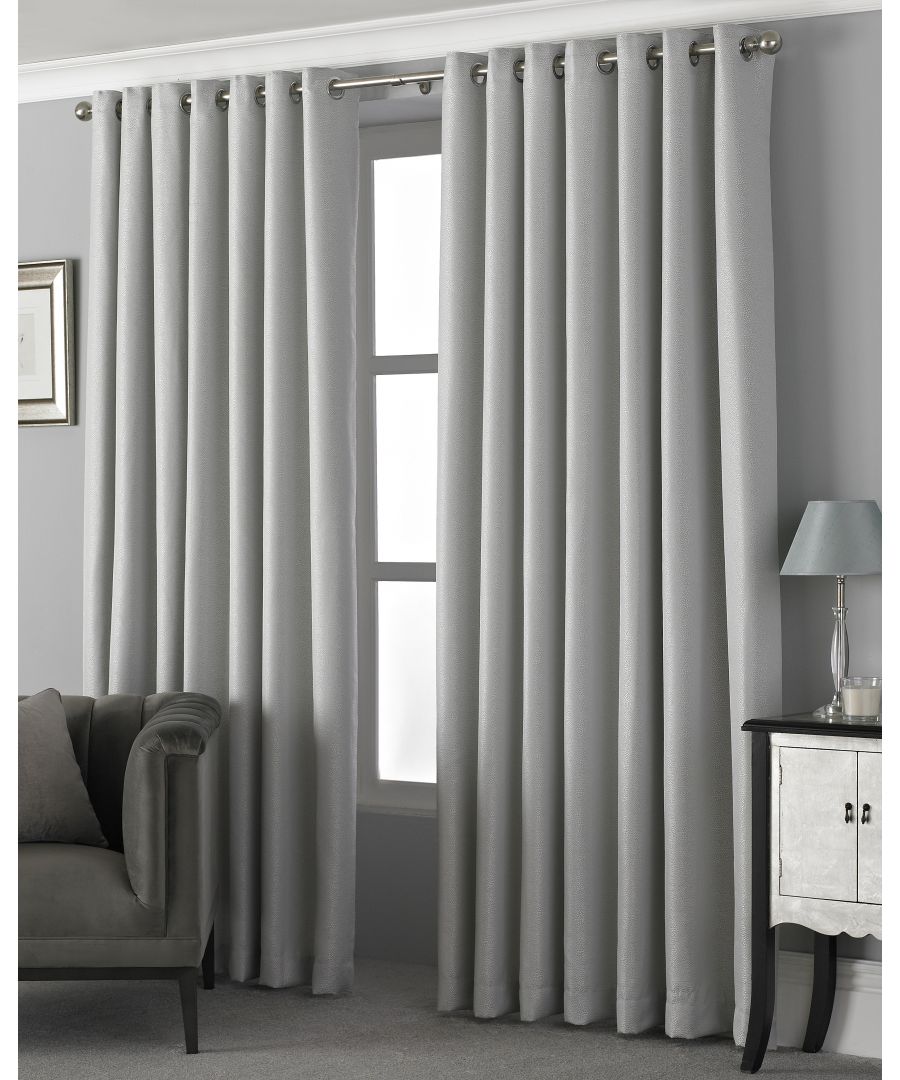 The Paoletti Pendleton eyelet curtains are at the height of luxury. Made form high-quality polyester fabric with a detailed micro dot design these curtains catch the light at every angle. Available in two modern colours of graphite or silver they suit a range of home interiors. Stainless steel eyelet rings makes these modern curtains easy to install with no need for hook or rings. The thick fabric provides you with room darkening qualities making them great in the bedroom. These curtains must be treated carefully and are therefore dry clean only.