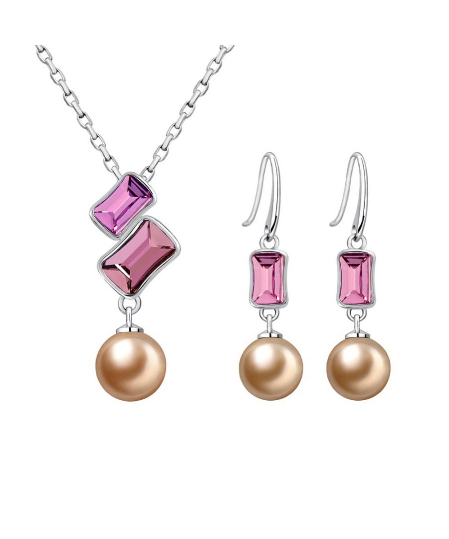 Pearl and Pink Swarovski Elements Crystal Set Consists of a pendant and a pair of dangling earrings, perfect combination of pearl and crystal for a fresh, modern design. Description of pendant: Gold pearl crystal and Swarovski Elements light pink and dark pink Dimension: 3 x 1.5 cm Length of the chain: 40 cm adjustable Description of the earrings: Gold pearl and Swarovski Elements crystal clear pink Hanging hook Dimension: 3.5 x 0.8 cm Rhodium-plated frame.