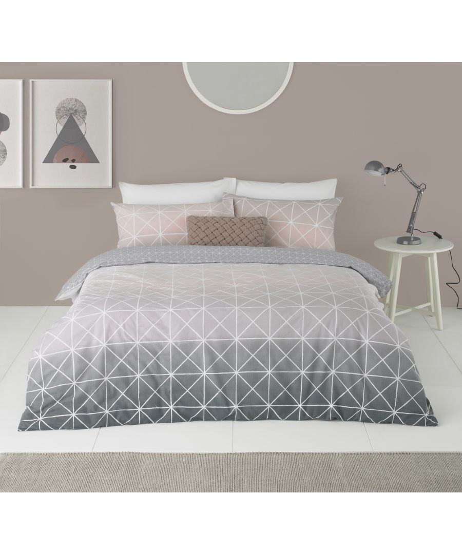 Featuring a gorgeous gradient flowing from a crisp white, to soft pink and finishing on a beautiful grey the Spectrum duvet cover set is a versatile piece. Complete with thin white lines in a geometric pattern it brings a modern touch that will elevate your bedroom into a contemporary space. The reverse has a matching plain grey with white dots to neutralise the statement front. Each duvet set comes with matching pillowcases with a reversible design. Made of crisp polycotton making this duvet set soft and hard-wearing. This duvet cover features a secure button closure while the pillowcases have an envelope closure. Machine washable on a 40 degree cycle. Iron cool and tumble dry on a low setting for the best finish.