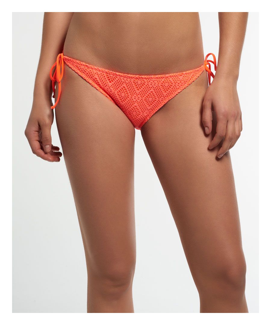 Superdry women's diamond lace bikini bottoms. A pair of lace bikini bottoms featuring spaghetti strap side ties and a subtle metal Superdry logo badge on the back of the waistband.