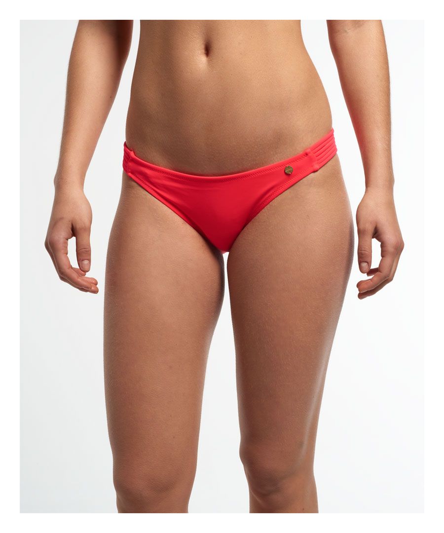 Superdry women's Santorini bandeau bikini bottoms.  A pair of bikini bottoms in low rise hipster styling feature side strappy details and finished with a small metal Superdry logo on the hip. Please note due to hygiene reasons, we are unable to offer an exchange or refund on swimwear unless they are sealed in their original packaging. This does not affect your statutory rights.