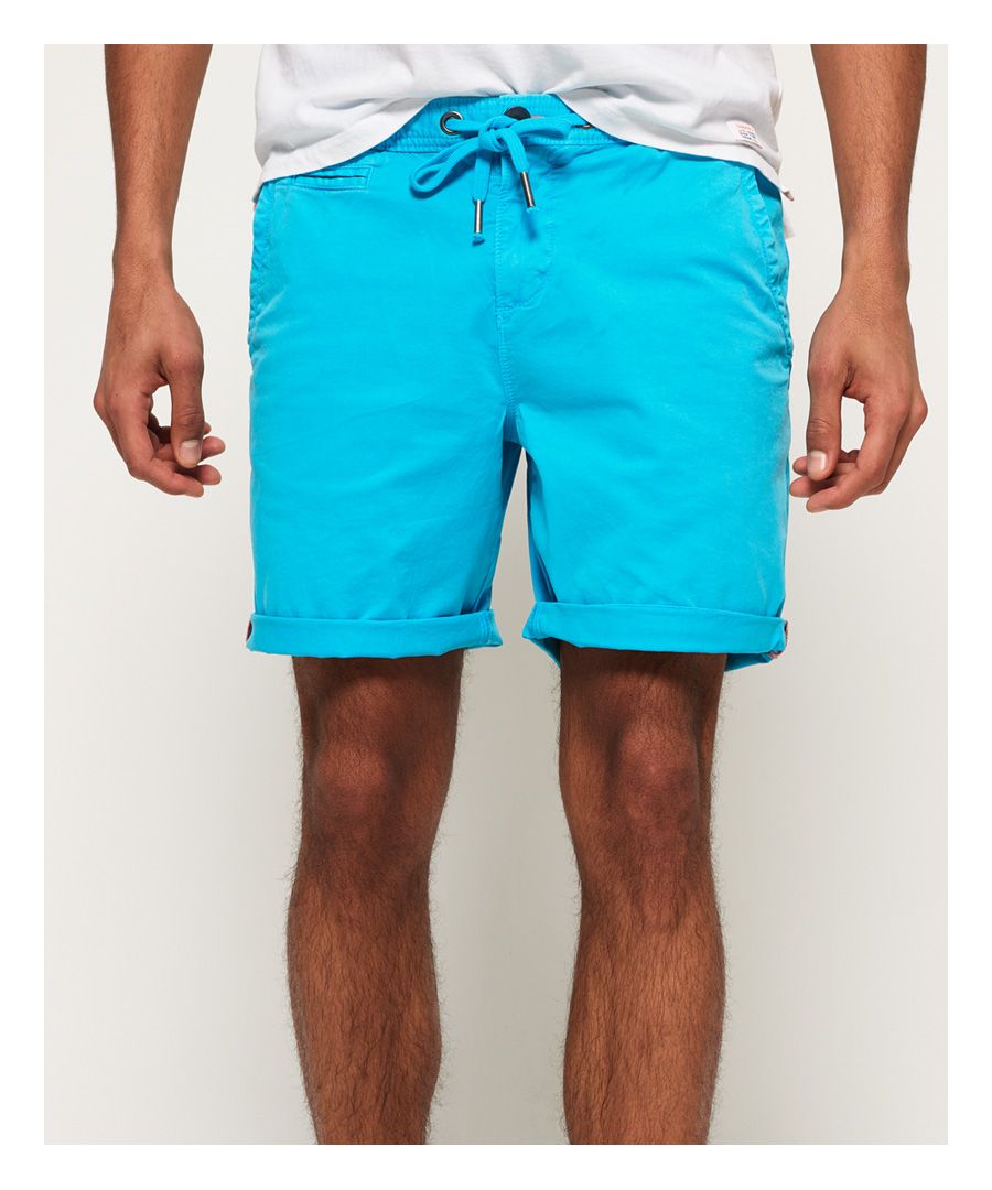 Superdry men's Sunscorched shorts. These shorts feature a five pocket design, one with a button and small coin pocket. Also featured is a zip and button fastening and drawstring waist to adjust for comfort. Complete with a textured stripe design, Superdry logo badge on one back pocket and Superdry logo tab on one front pocket.