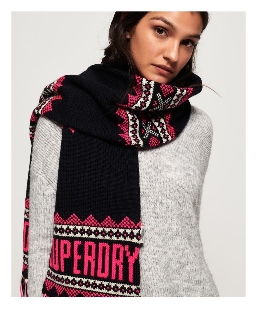 Superdry women’s Jenna Fairisle scarf. Wrap up warm this season in the Jenna scarf, featuring tassel detailing and Superdry logos incorporated within the print.